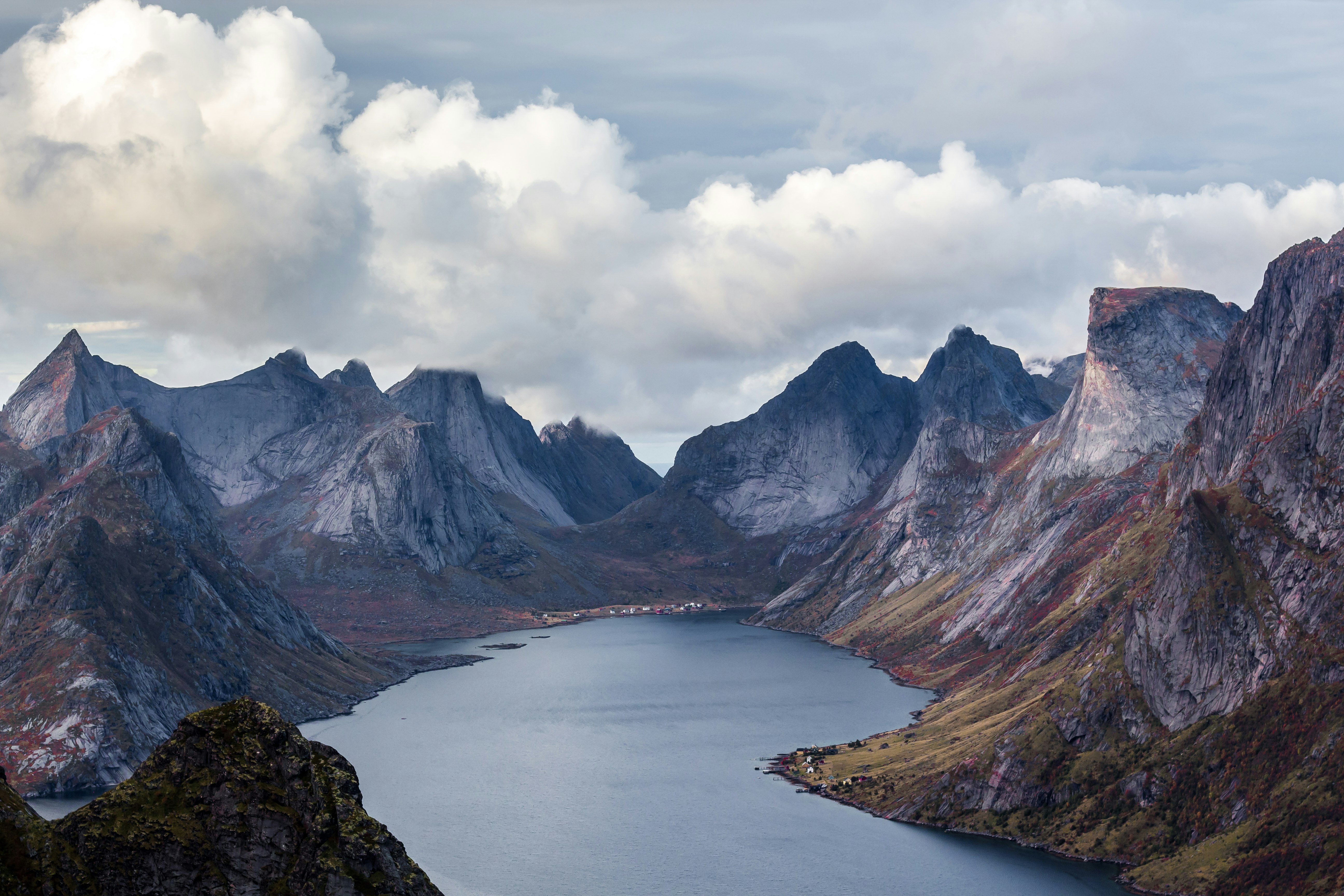 body of water surrounded mountain peak